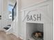 Hallway with a stairway, a custom dog house under the stairs, and a window at 333 Bremerton Dr, Goose Creek, SC 29445