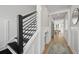 Hallway with a stairway, a custom dog house under the stairs, and an open view to the dining area at 333 Bremerton Dr, Goose Creek, SC 29445