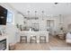 Bright, modern kitchen with white cabinetry, stainless steel appliances, and a breakfast bar with seating at 333 Bremerton Dr, Goose Creek, SC 29445