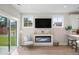 Cozy living area featuring an electric fireplace, large windows, and neutral decor for a relaxing atmosphere at 333 Bremerton Dr, Goose Creek, SC 29445