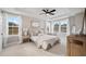 Serene main bedroom featuring a tray ceiling, multiple windows, and soft, neutral decor at 333 Bremerton Dr, Goose Creek, SC 29445