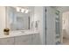 Well-lit bathroom featuring a large mirror, bright white cabinets, and a doorway to another room at 3424 Henrietta Hartford Rd, Mount Pleasant, SC 29466