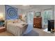 Cozy bedroom with natural light, patterned tapestry, white furniture, and hardwood floors at 3424 Henrietta Hartford Rd, Mount Pleasant, SC 29466