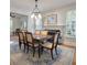 Formal dining room with chandelier and natural light, perfect for hosting gatherings and creating lasting memories at 3424 Henrietta Hartford Rd, Mount Pleasant, SC 29466