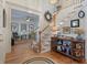 Inviting foyer with wood floors, staircase, and views into the living room at 3424 Henrietta Hartford Rd, Mount Pleasant, SC 29466