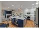 Modern kitchen with a large island, stainless steel appliances, and an open floor plan for easy entertaining at 3424 Henrietta Hartford Rd, Mount Pleasant, SC 29466
