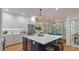 Spacious kitchen with stainless appliances, an island with seating, and a view into the breakfast nook at 3424 Henrietta Hartford Rd, Mount Pleasant, SC 29466