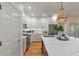 Renovated kitchen featuring white cabinetry, stainless steel appliances, and a central island with seating at 3424 Henrietta Hartford Rd, Mount Pleasant, SC 29466