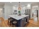 Stylish kitchen with an island, stainless steel appliances, and hardwood floors, creating a modern and functional space at 3424 Henrietta Hartford Rd, Mount Pleasant, SC 29466