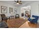 Bright living room featuring stylish seating, hardwood floors, and artwork, creating a comfortable and inviting atmosphere at 3424 Henrietta Hartford Rd, Mount Pleasant, SC 29466