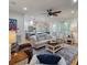 Open-concept living room featuring hardwood floors, a comfortable seating area, and access to the kitchen at 3424 Henrietta Hartford Rd, Mount Pleasant, SC 29466