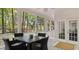 Outdoor patio space with a table and seating set, offering views of the lush greenery at 3424 Henrietta Hartford Rd, Mount Pleasant, SC 29466