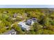 This aerial captures a neighborhood nestled among lush greenery, with homes peeking through the trees at 3683 Nassas St, Mount Pleasant, SC 29466