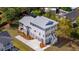 Aerial of a modern home featuring a large driveway, an attached garage, and a rear deck at 3683 Nassas St, Mount Pleasant, SC 29466