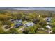 An aerial view of a home surrounded by trees, with a marsh visible in the background at 3683 Nassas St, Mount Pleasant, SC 29466