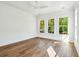 Bright bedroom with large windows offering plenty of natural light and hardwood floors at 3683 Nassas St, Mount Pleasant, SC 29466