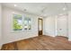 Bright bedroom features hardwood floors, natural light, and a ceiling fan at 3683 Nassas St, Mount Pleasant, SC 29466