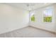 Bedroom with neutral carpet, recessed lights, and two bright windows at 3683 Nassas St, Mount Pleasant, SC 29466