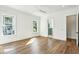 Spacious bedroom with hardwood floors, view of bathroom, and abundant natural light at 3683 Nassas St, Mount Pleasant, SC 29466