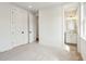 This bedroom offers neutral carpet, trim detail, a double door closet, and adjoins a bathroom at 3683 Nassas St, Mount Pleasant, SC 29466
