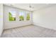 Bright bedroom features plush carpet flooring, natural light, and a ceiling fan at 3683 Nassas St, Mount Pleasant, SC 29466