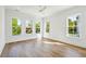 Bright bedroom with ample natural light from large windows and beautiful hardwood floors at 3683 Nassas St, Mount Pleasant, SC 29466