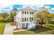 Stunning two-story home featuring a light exterior, double porches, manicured landscaping, and a private driveway at 3683 Nassas St, Mount Pleasant, SC 29466