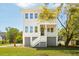 Beautifully designed two-story home featuring double porches, a manicured lawn, and inviting curb appeal at 3683 Nassas St, Mount Pleasant, SC 29466
