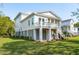 White two-story house with screened in porch, deck, and white stairs at 3683 Nassas St, Mount Pleasant, SC 29466