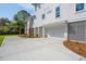 Side view of a two-story home featuring an attached garage and concrete driveway at 3683 Nassas St, Mount Pleasant, SC 29466