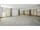 Spacious garage area with concrete floor, wooden slat walls, and white door at 3683 Nassas St, Mount Pleasant, SC 29466
