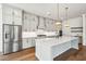Spacious kitchen featuring gray cabinets, stainless steel appliances, and an island with marble countertop at 3683 Nassas St, Mount Pleasant, SC 29466