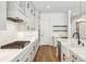 Bright, modern kitchen with gray cabinetry, stainless steel appliances, and a gas cooktop on marble counters at 3683 Nassas St, Mount Pleasant, SC 29466