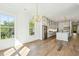 Bright kitchen featuring stainless steel appliances, an island, and stylish pendant lighting at 3683 Nassas St, Mount Pleasant, SC 29466