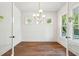 Bright living room with hardwood floors, recessed lights, large windows, and stylish modern chandelier at 3683 Nassas St, Mount Pleasant, SC 29466