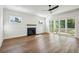 Living room with hardwood floors, fireplace, and sliding glass doors to the patio at 3683 Nassas St, Mount Pleasant, SC 29466