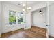 Bright living room with hardwood floors and stylish modern chandelier at 3683 Nassas St, Mount Pleasant, SC 29466