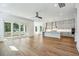 Open-concept living space with hardwood floors, kitchen, and sliding glass doors to the patio at 3683 Nassas St, Mount Pleasant, SC 29466