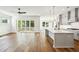 Open-concept living space with hardwood floors, kitchen, and sliding glass doors to the patio at 3683 Nassas St, Mount Pleasant, SC 29466