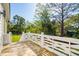 Open air porch features wood floor, white railing and a green view of trees and grass at 3683 Nassas St, Mount Pleasant, SC 29466