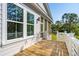 Bright porch with wood floor, railing and exterior view of the siding of the house at 3683 Nassas St, Mount Pleasant, SC 29466