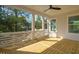 Light-filled screened porch with wood flooring, ceiling fan, and a view of the outdoors at 3683 Nassas St, Mount Pleasant, SC 29466