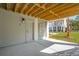 Under deck area with concrete floor, door, and wood slat walls at 3683 Nassas St, Mount Pleasant, SC 29466