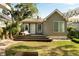 Beautiful backyard with a wooden deck, lush grass, and a charming exterior view of the home at 40 Dunnemann Ave, Charleston, SC 29403