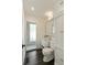 Bright bathroom featuring a marble countertop, white cabinetry, and a glass-enclosed shower for a spa-like experience at 40 Dunnemann Ave, Charleston, SC 29403