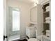 Bright bathroom featuring a marble countertop, white cabinetry, and a glass-enclosed shower for a spa-like experience at 40 Dunnemann Ave, Charleston, SC 29403