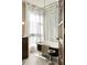 Bright bathroom showcasing a clawfoot tub with chrome shower hardware and a large window at 40 Dunnemann Ave, Charleston, SC 29403