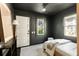 Cozy bedroom with gray walls, white trim, and a comfortable bed, plus a window letting in natural light at 40 Dunnemann Ave, Charleston, SC 29403