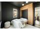 Modern bedroom features stylish built-in storage and a comfortable bed with a view through to the hallway at 40 Dunnemann Ave, Charleston, SC 29403