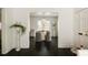 Elegant dining area with a stylish chandelier, view to kitchen and plush velvet chairs at 40 Dunnemann Ave, Charleston, SC 29403